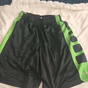 Nike Black and Green Athletic Shorts with Bold Accents